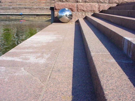 a Silver Ball on the steps to the water in Helsinki, Finland