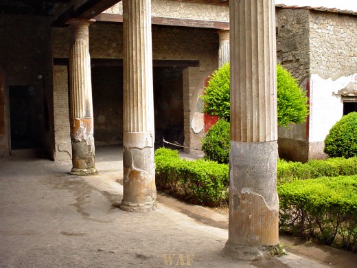 Columns and buildings in Pompeii, Italy that survived the Mt. Vesuvius 79 A.D. eruption