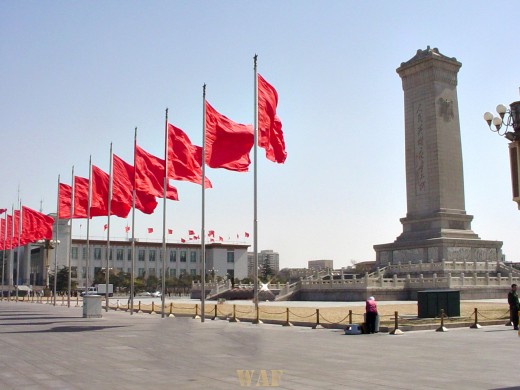 a row of red flags along Tiananmen Square (Beijing, China)